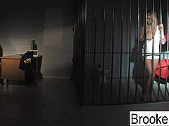 A big titty police and inmate in this BDSM video