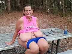 Mature woman strips and urinates in public
